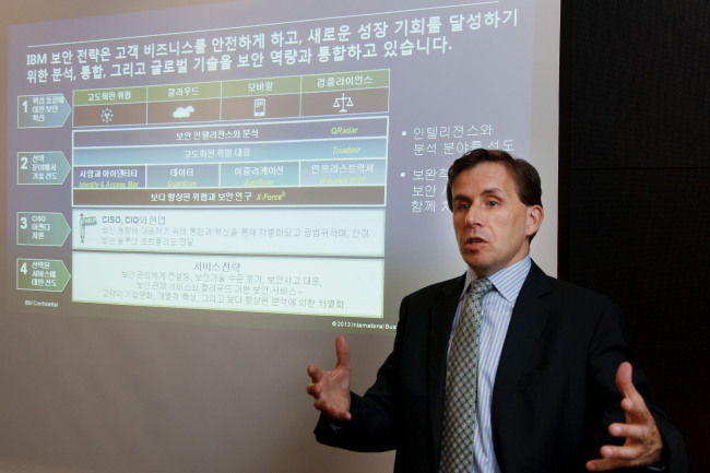 Brendan Hannigan, general manager of IBM’s security systems division, gives a presentation on its strategy in the security market in Seoul on Tuesday. (IBM)