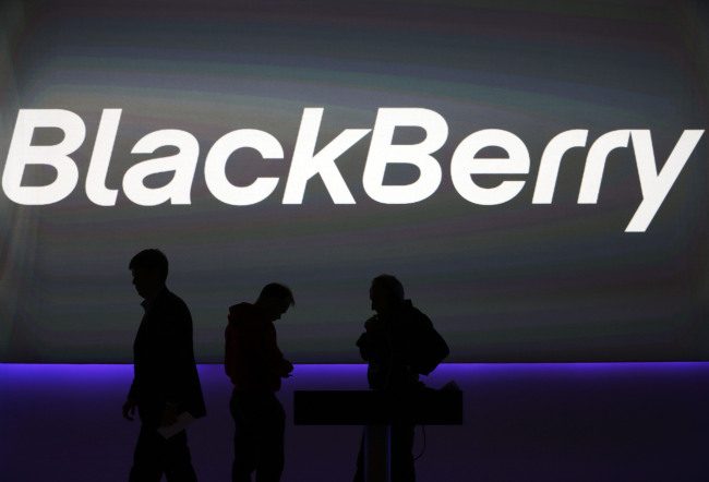 BlackBerry’s employees prepare for a launch event for new smartphones in London on Sept. 23. (AP-Yonhap News)