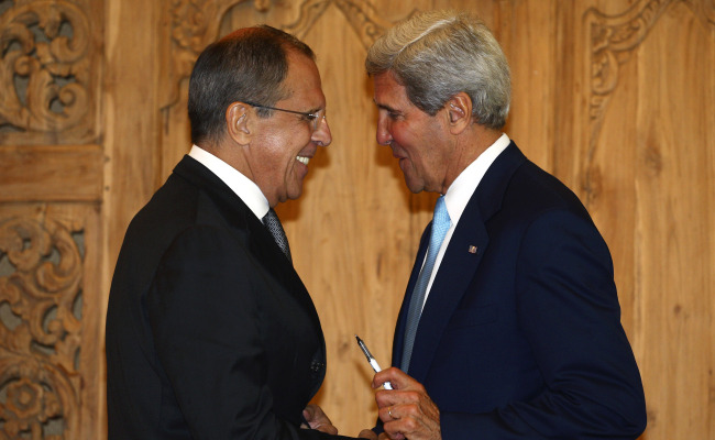 U.S. Secretary of State John Kerry (right) speaks with Russian Foreign Minister Sergey Lavrov after a joint press conference on the sidelines of the Asia-Pacific Economic Cooperation (APEC) summit in Bali, Indonesia, Monday.