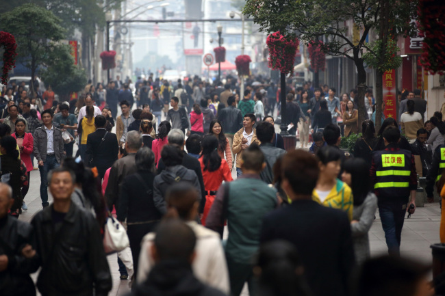 Shoppers walk along a shopping street in Wuhan, China. (Bloomberg)