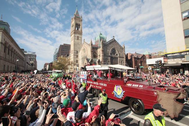 Duck boats make their way down Boylston Street, where fans gathered for the World Series victory parade for the Boston Red Sox in Boston, Massachusetts, Saturday. (AFP-Yonhap News)
