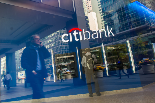 A customer uses an automated teller machine inside of a Citibank branch on Park Avenue in New York. (Bloomberg)