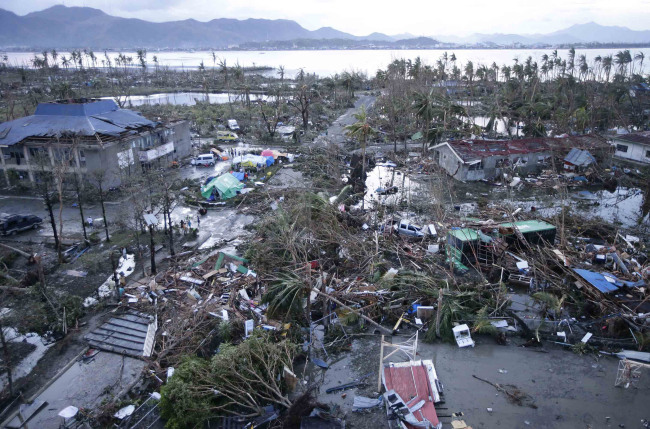 Tacloban Airport is covered by debris after powerful Typhoon Haiyan hit Tacloban city, in Leyte province in central Philippines, Saturday. (AP/Yonhap)