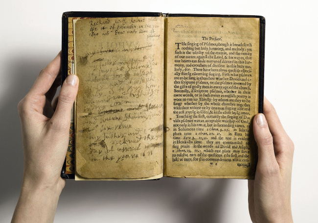 This April 2013 file photo provided by Sotheby’s and taken in New York shows what the auction house describes as “the world’s most valuable book,” the Bay Psalm Book, which was the first book ever printed in what is now the United States. (AP-Yonhap News)