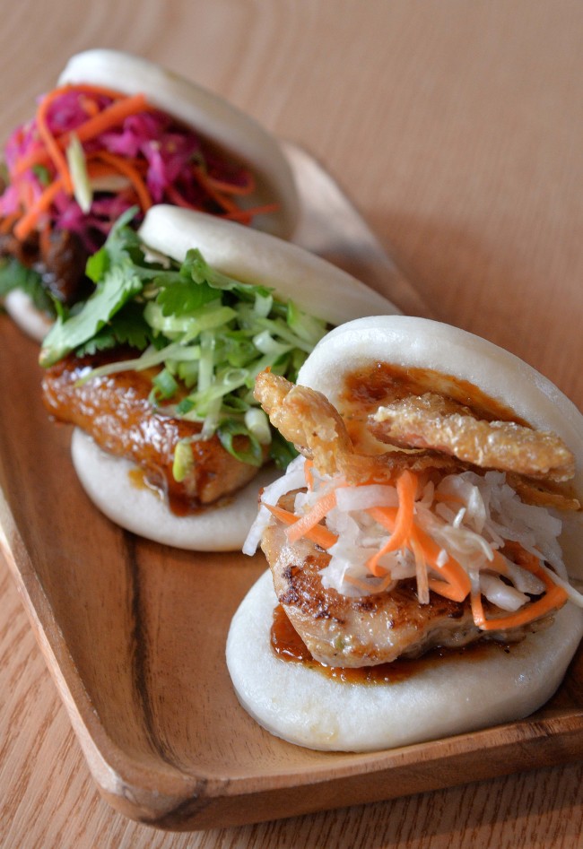 Left Coast Artisan Burgers’ mouthwatering bao buns (left to right) ― Kalbi Jjim, Little Piggy and Chicken.(Lee Sang-sub/The Korea Herald)