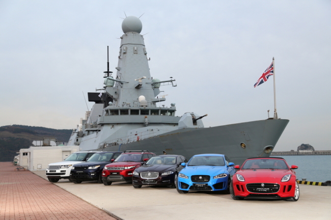 Jaguar Land Rover vehicles, including the F-Type and the Range Rover, are displayed at a reception for British destroyer HMS Daring on Wednesday. (Jaguar Land Rover Korea)