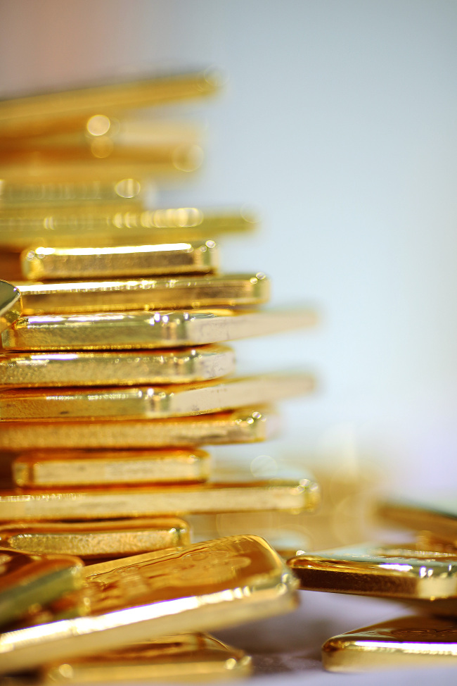 Gold bars are arranged for a photograph at the YLG Baullion International Co. headquarters in Bangkok. (Bloomberg)