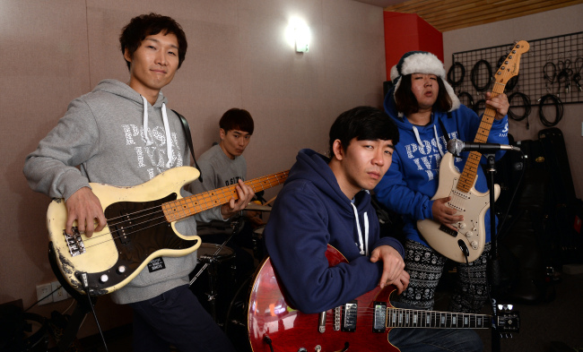 Members of Rock ’N’ Roll Radio pose in their practice studio in Seogyo-dong, Seoul, Wednesday.(Ahn Hoon/The Korea Herald)
