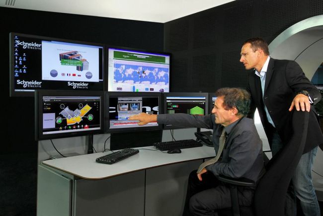 Specialists of Schneider Electric monitor the energy management system installed in the company’s headquarters in Rueil Malmaison, near Paris. (Schneider Electric)