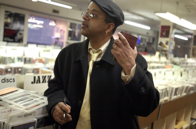 Author and musician James McBride browses through jazz music during a stop in Chicago. (MCT)