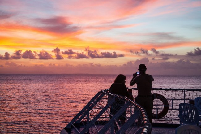 Passengers take in a glorious South Pacific sunset off Ua Huka in the Marquesas Islands. (Steve Haggerty/MCT)