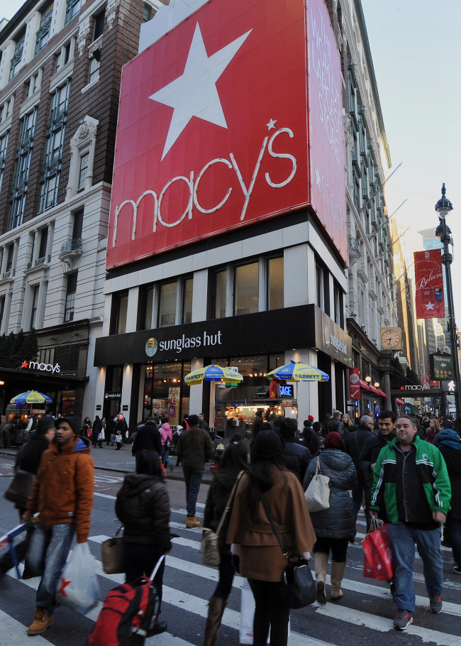 Pedestrians walk past Macy’s Inc. flagship store in New York. (Bloomberg)