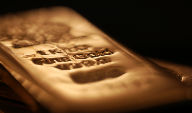 A gold bar is seen in this arranged photograph at Gold Investments Ltd. bullion dealers in London.(Bloomberg)