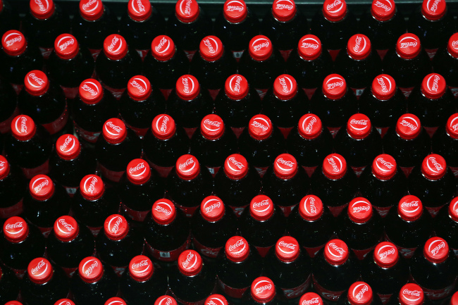 Bottles of Coca-Cola move along the production line at the Coca-Cola Co. bottling plant in Hmawbi, Myanmar. (Bloomberg)