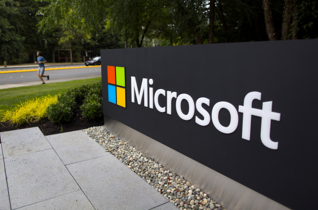 A Windows operating system logo sits on display outside Microsoft Corp.’s new store in Germany. (Bloomberg)