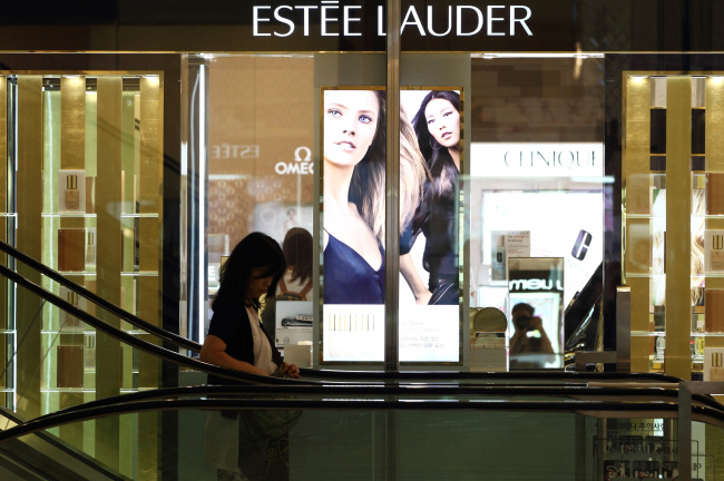 A customer enters the cosmetics section of a Seoul department store. (Bloomberg)