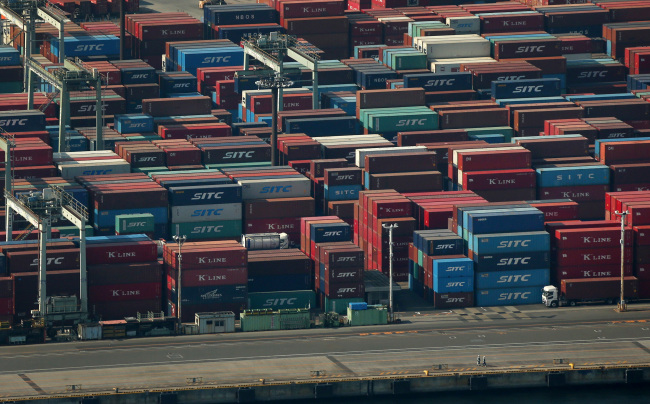 Shipping containers are stacked at the Oi Container Terminal in Tokyo. (Bloomberg)