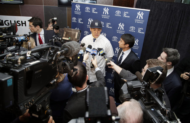 New York Yankees pitcher Masahiro Tanaka talks to the media on Tuesday. (USA Today-Yonhap)