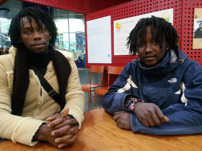 Dancer Emmanuel Migaelle Sanou (left) and musician Abdoul Razak Ouedraogo, both from Burkina Faso, talk with The Korea Herald about their two-year ordeal working at the African Museum of Original Art ahead of their meeting at the Korea National Commission for Human Rights in Seoul on Thursday.(Philip Iglauer/The Korea Herald)