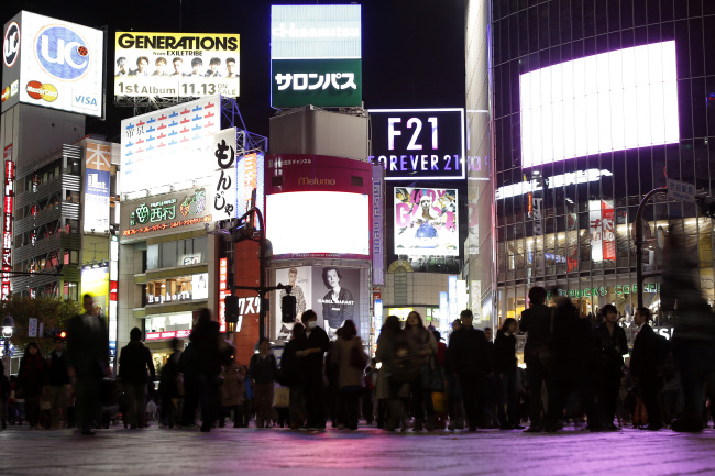 Pedestrians walk through a street in the Shibuya district of Tokyo. (Bloomberg)