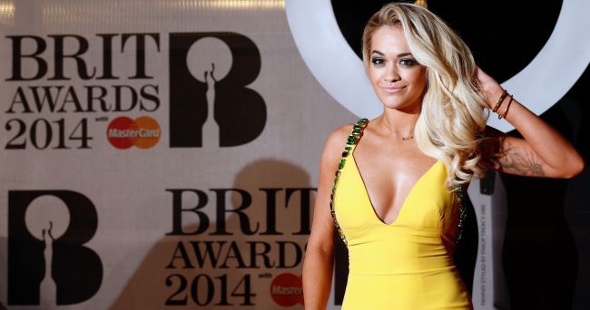 British singer-songwriter Rita Ora poses on the red carpet after arriving at the BRIT Awards in London on Wednesday. (AFP-Yonhap)