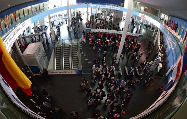 Visitors fill the main exhibition hall Tuesday at the Fira Gran Via in Barcelona, Spain, where the Mobile World Congress is taking place this week. (MWC press corps)