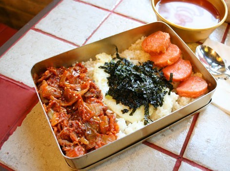 A retro meal of rice, egg, stir-fried kimchi and ham is served in a tin lunchbox. (Miss Lee Cafe)