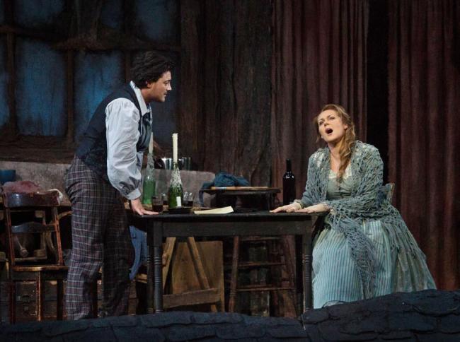 Vittorio Grigolo portrays Rodolfo with Kristine Opolais (right) as Mimi in the Metropolitan Opera’s broadcast of Puccini’s “La Boheme” on Saturday. (AP-Yonhap)