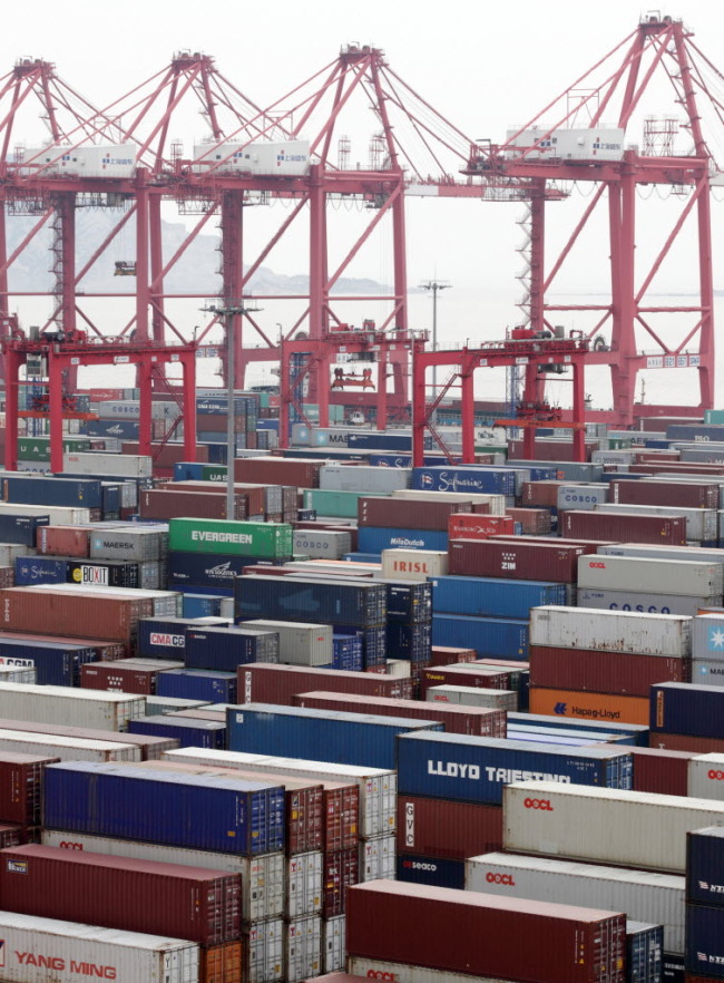 Shipping containers are stacked at the Yangshan Deep Water Port in ShanghaI. (Bloomberg)