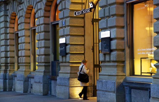 A visitor enters the Credit Suisse Group AG headquarters in Zurich, Switzerland. (Bloomberg)