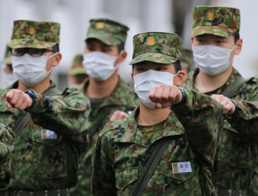 National Defense Academy of Japan cadets march to class at the NDA campus in Yokosuka, Kanagawa Prefecture, Japan, on Monday, (Bloomberg)