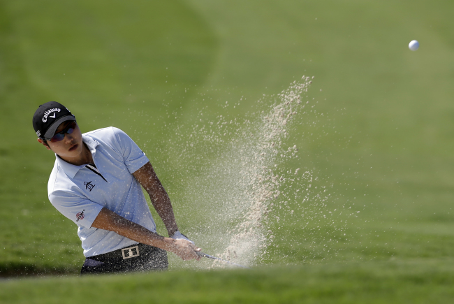 Bae Sang-moon hits out of a bunker onto the third green during the Byron Nelson Championship in Irving, Texas, Thursday. (AP-Yonhap)