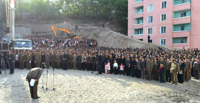 An unidentified North Korean official apologizes to local citizens for the collapse of an apartment building under construction in Pyongyang. (Yonhap)