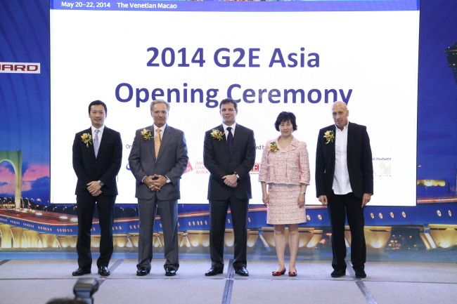 The Non-Gaming Executive Exhibition Association, aiming to diversify Macau’s casino-focused industry, kicked off on Tuesday at the Global Gaming Expo Asia 2014 opening ceremony. From left: Michael Mecca, president and CEO of Galaxy Entertainment Group; Ted Chan, CEO of Melco Crown Entertainment; Geoff Freeman, president and CEO of the American Gaming Association; Pansy Ho, cochairperson and executive director of MGM China Holdings; and Allan Zeman, chairman and founder of Lan Kwai Fong Concepts. (G2E Asia)