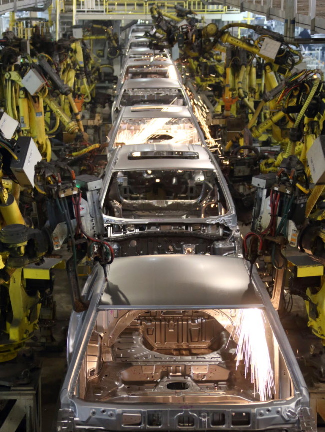 Robots work on the welding line at a Hyundai Motor Co. plant in Beijing. (Bloomberg)