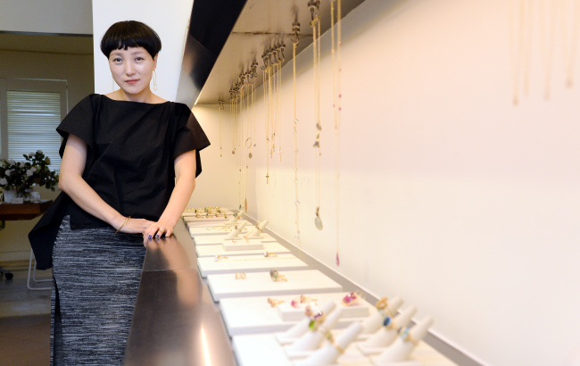 Jewelry designer Jung Soo-yeon of Tanello poses for a photo at her jewelry store in Itaewon, Seoul, Wednesday. (Ahn Hoon/The Korea Herald)