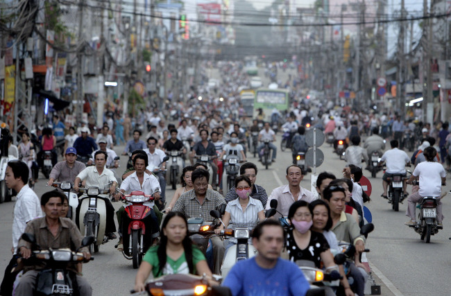 Motorcyclists ride along a busy street in Ho Chi Minh City, Vietnam. (Bloomberg)