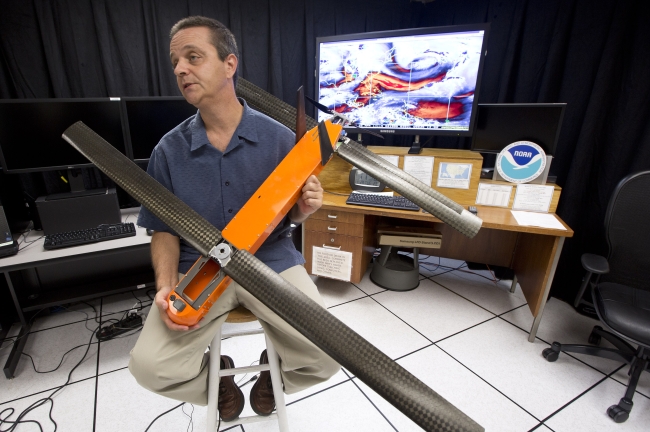 Joe Cione displays a drone for hurricane research. (AP-Yonhap)