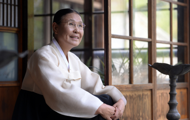 Lee Seon-jong, head of Eun Deok Cultural Center, poses in front of Inhwadang at the center in Wonseo-dong, Seoul, on May 22. (Ahn Hoon/The Korea Herald)