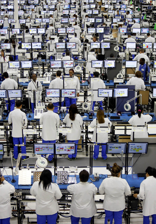 Employees assemble Motorola Solutions Inc. Moto X smartphones at the Flextronics International Ltd. factory in Fort Worth, Texas. (Bloomberg)