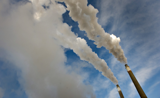 Steam rises from exhaust stacks at the Great River Energy Coal Creek Station coal-fueled power plant in Underwood, North Dakota. (Bloomberg)