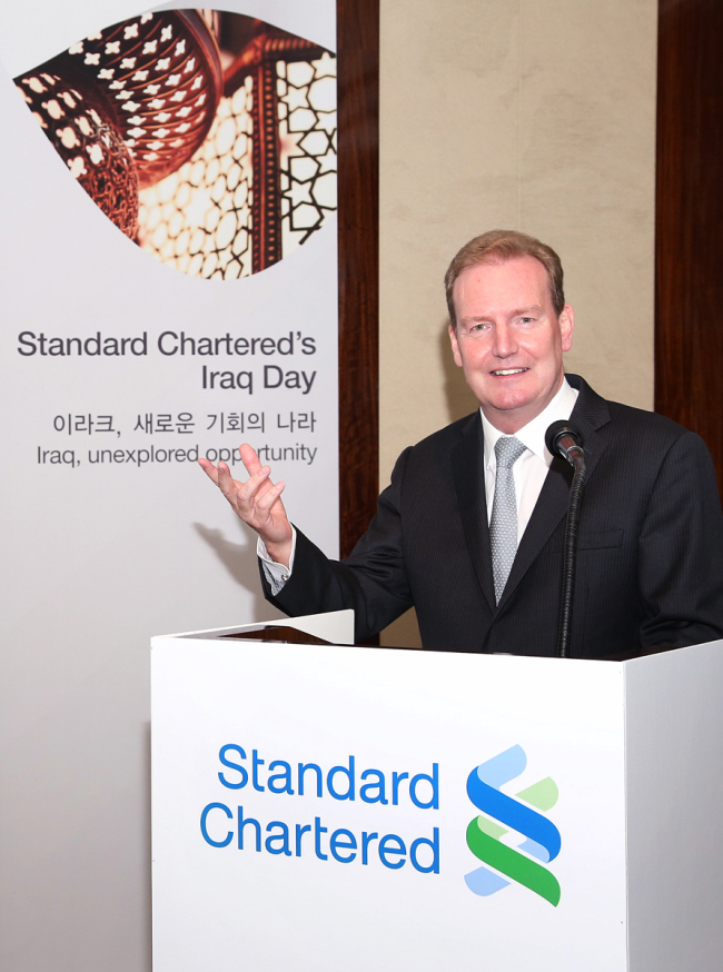 Gavin Wishart, CEO of Standard Chartered Bank Iraq, delivers a presentation during SC Bank Korea’s Iraq Day event in Seoul on Monday. (SC Bank Korea)