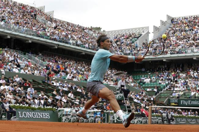 Spain’s Rafael Nadal returns a shot at the French Open on Monday. (AFP-Yonhap)