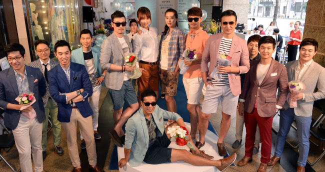 Models on Sunday pose during a fashion show at Lotte Department Store in Seoul, promoting “cool-biz” attire, or summer work wear for men. (Ahn Hoon/The Korea Herald)