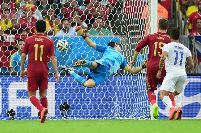 Spain’s goalkeeper Iker Casillas can’t make a save against Chile during a World Cup soccer match on Wednesday. Spain was eliminated from the tournament after losing 2-0. (AFP-Yonhap)