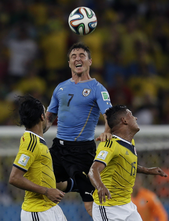 Uruguay`s Cristian Rodriguez jumps high to head the ball during the World Cup round of 16 soccer match between Colombia and Uruguay at the Maracana Stadium in Rio de Janeiro, Brazil, Saturday. (AP)