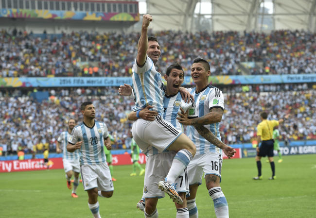 Argentina’s Lionel Messi is lifted into the air after scoring against Nigeria at the World Cup. (AP-Yonhap)