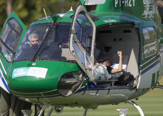 Brazil`s Neymar lies inside a medical helicopter at the Granja Comary training center, in Teresopolis, Brazil, Saturday. (AP)