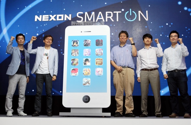 Chung Sang-won, vice president of Nexon Korea (third from right), and executives of Nexon’s subsidiaries pose at a press meeting before unveiling their new mobile games in Seoul on Tuesday. (Nexon Korea)