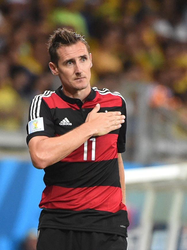 Germany's forward Miroslav Klose celebrates after scoring their second goal during the semi-final football match between Brazil and Germany at The Mineirao Stadium in Belo Horizonte on July 8, 2014, during the 2014 FIFA World Cup. (AP-Yonhap)